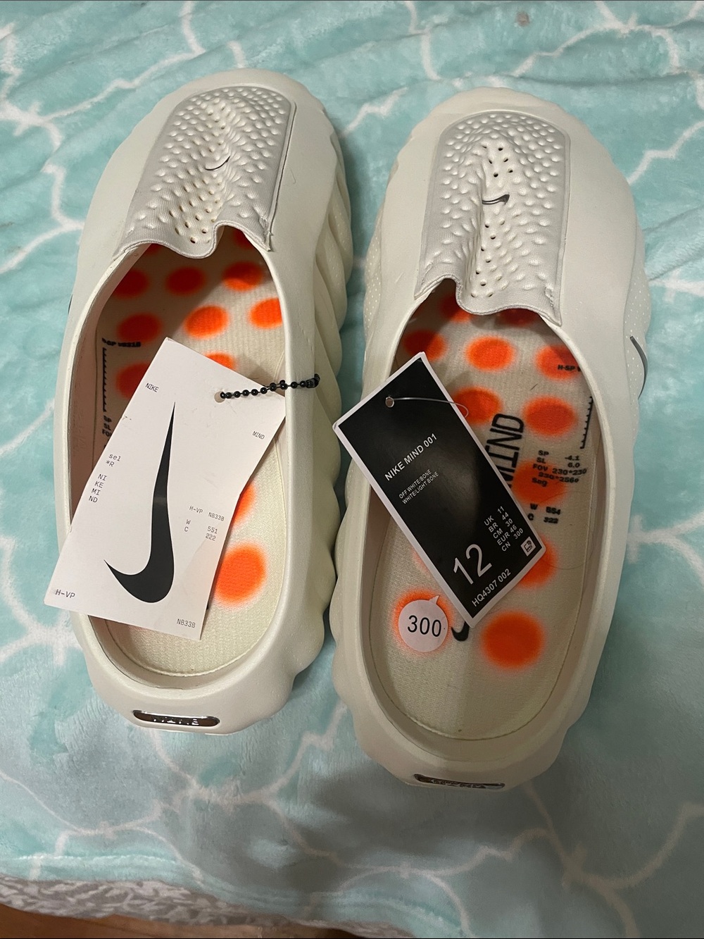 Nike Men's Slip-On Foam Clogs in White with Orange Polka-Dot Insole